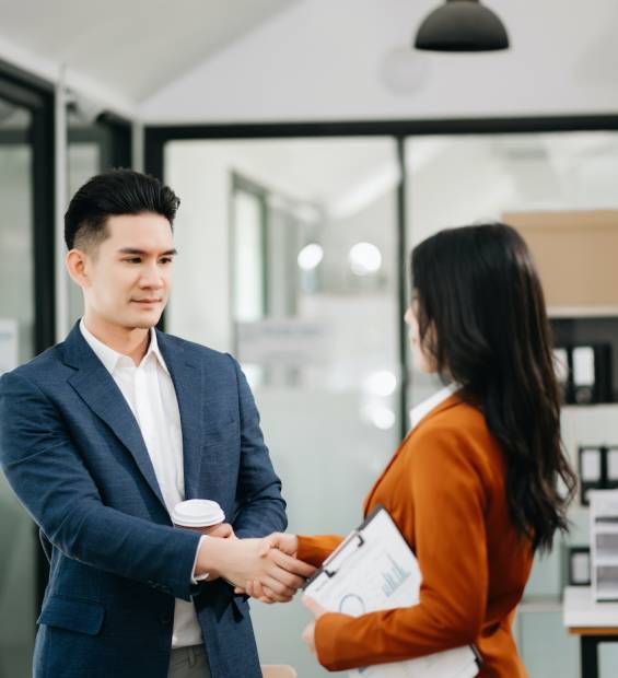 Business partnership handshake concept.Photo two coworkers handshaking process.Successful deal after great meeting.