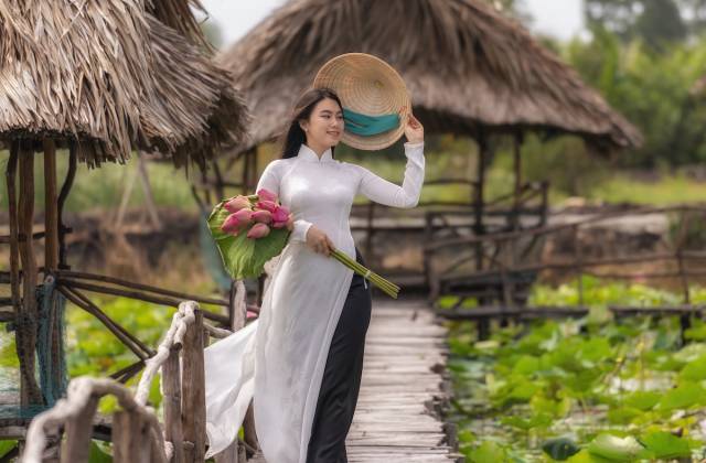 Portrait of beautiful vietnamese woman with traditional vietnam hat